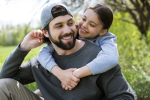 Photo - happy daughter hugging happy father